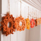 Macrame Snowflake Garland – 9 Handmade Snowflakes in Warm Orange + Yellow