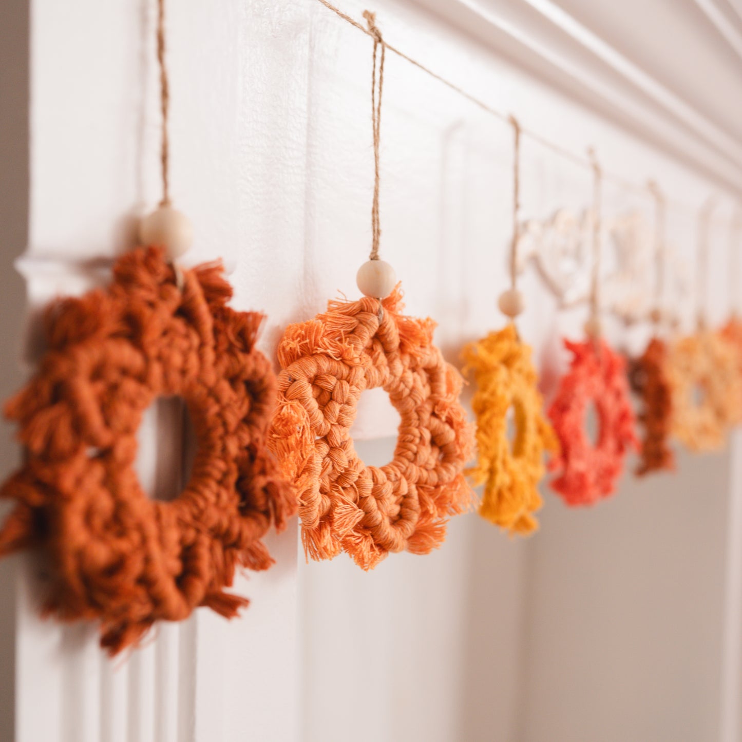 Macrame Snowflake Garland – 9 Handmade Snowflakes in Warm Orange + Yellow