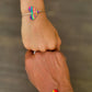 Macrame adjustable rainbow pride bracelet by A Branch & Cord. 